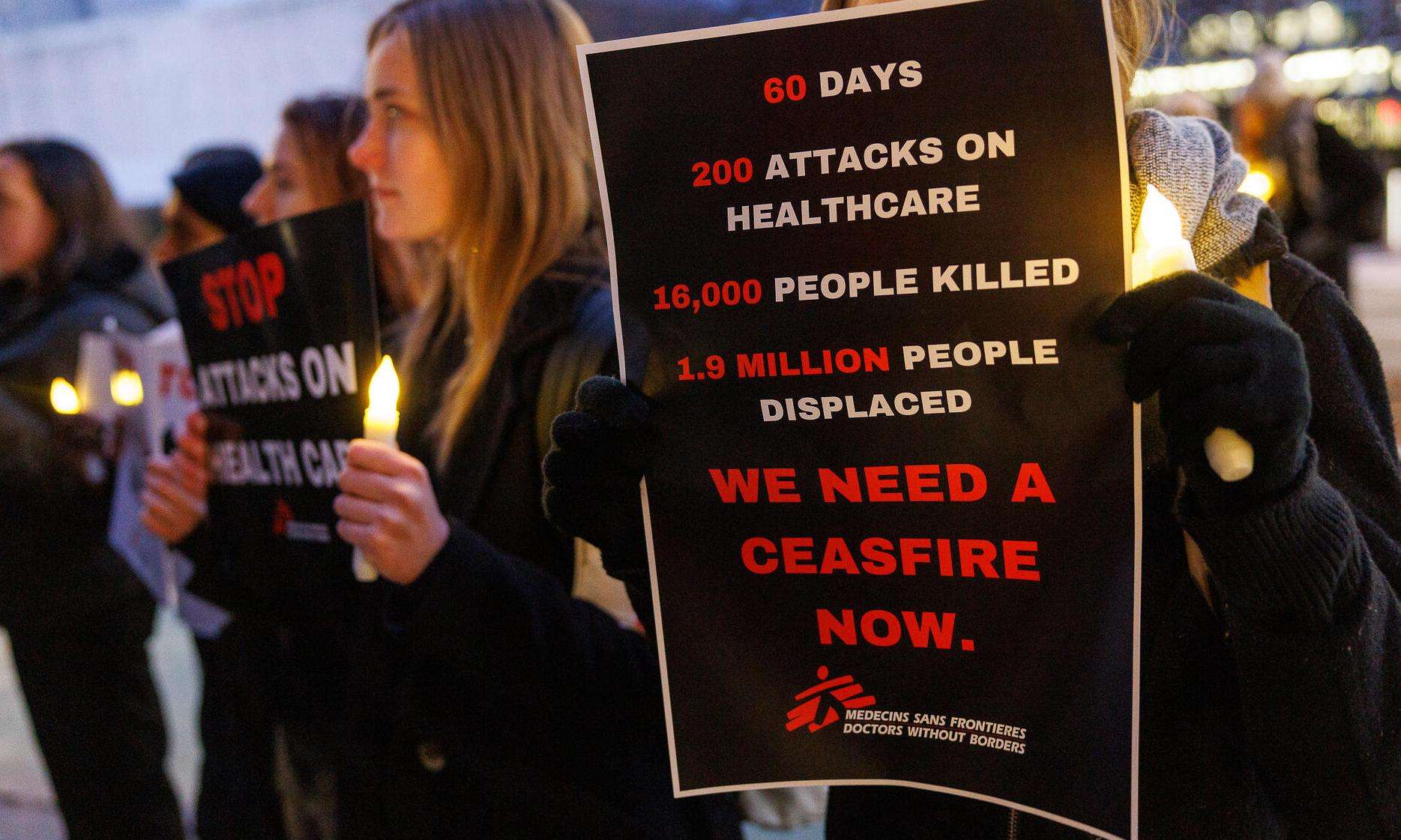 MSF-USA staff hold signs calling for a ceasefire in Gaza during a vigil at the United Nations in New York.
