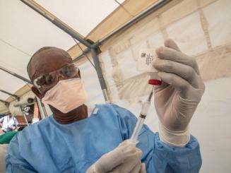 A nurse prepares an Ebola vaccine in Bikoro during the 2018-2020 Ebola epidemic in the Democratic Republic of Congo.