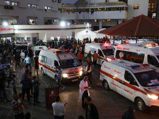 Ambulances and crowds around Al-Shifa hospital during the Israel-Gaza war in 2023.
