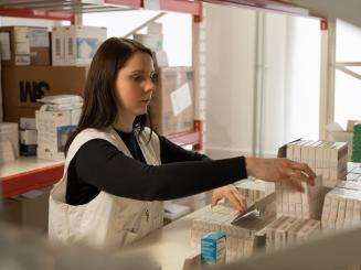 An MSF pharmacist chooses medicines in Zhytomyr, Ukraine.