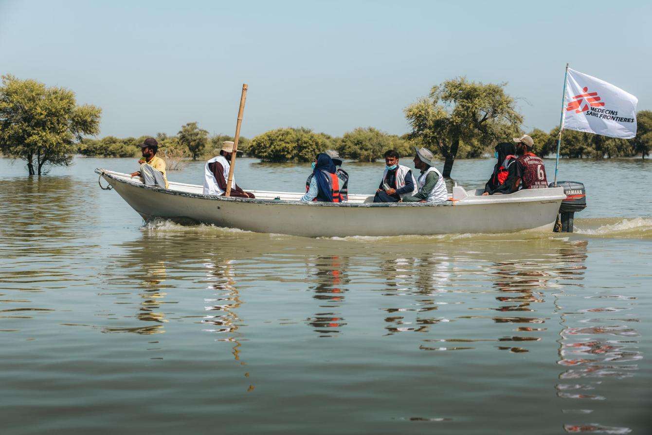 MSF teams travel by boat through flooded Dadu, Pakistan.