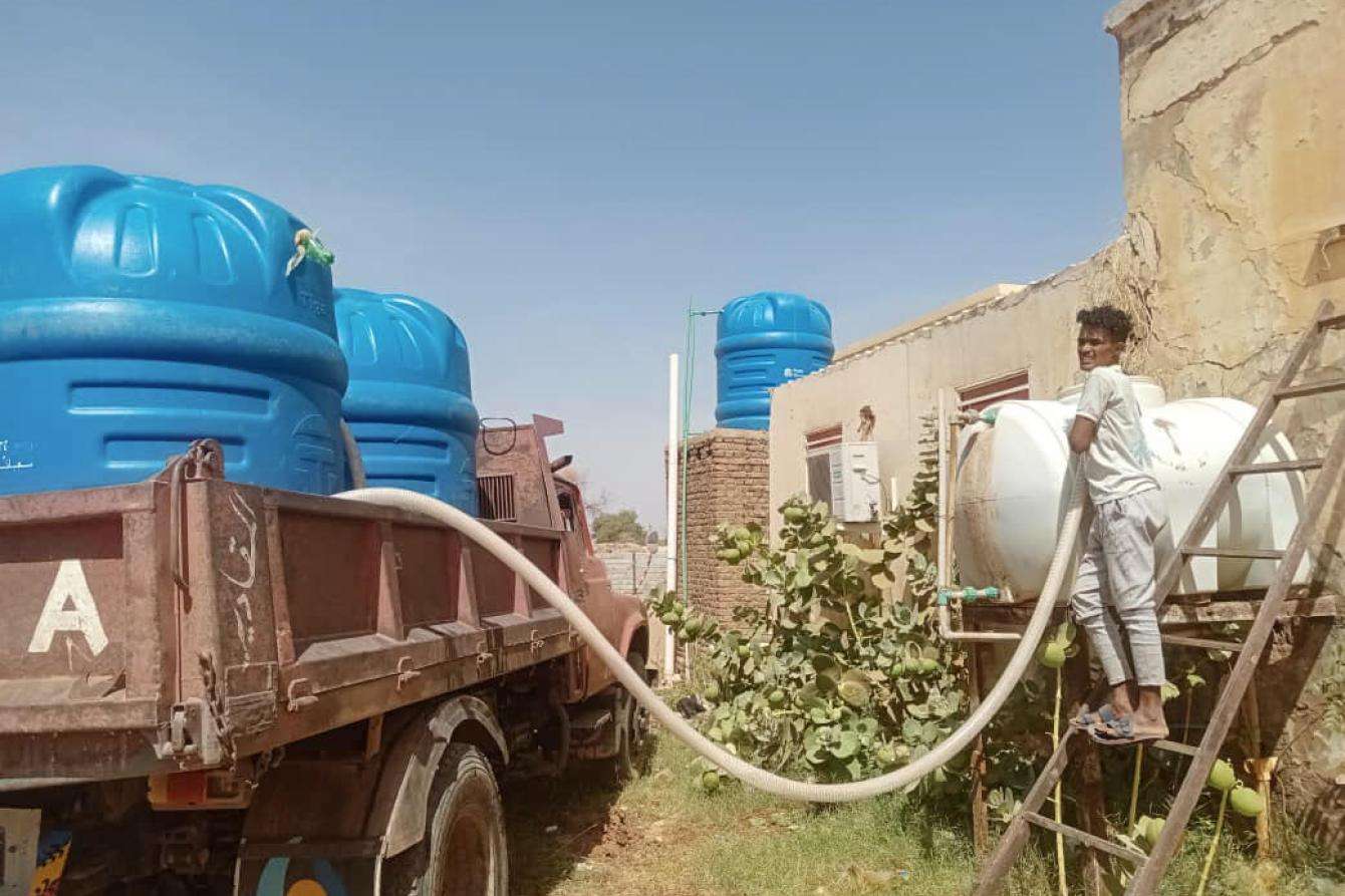 Jerry cans of water are delivered to a Khartoum hospital. 