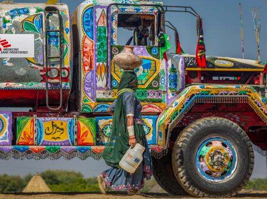 A colorful painted truck with MSF logo in Pakistan.