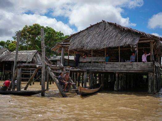 Wooden buildings on Orinoco river in Venezuela where Indigenous community lives