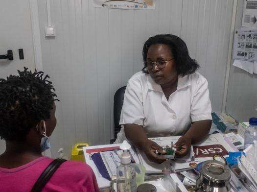 Cintia, a nurse and head of maternity and safe abortion services at Munhava Health Center in Beira, Mozambique, speaks with a patient.