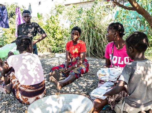 Ana Rita* sits among a group of women after receiving safe abortion care in Beira, Mozambique.
