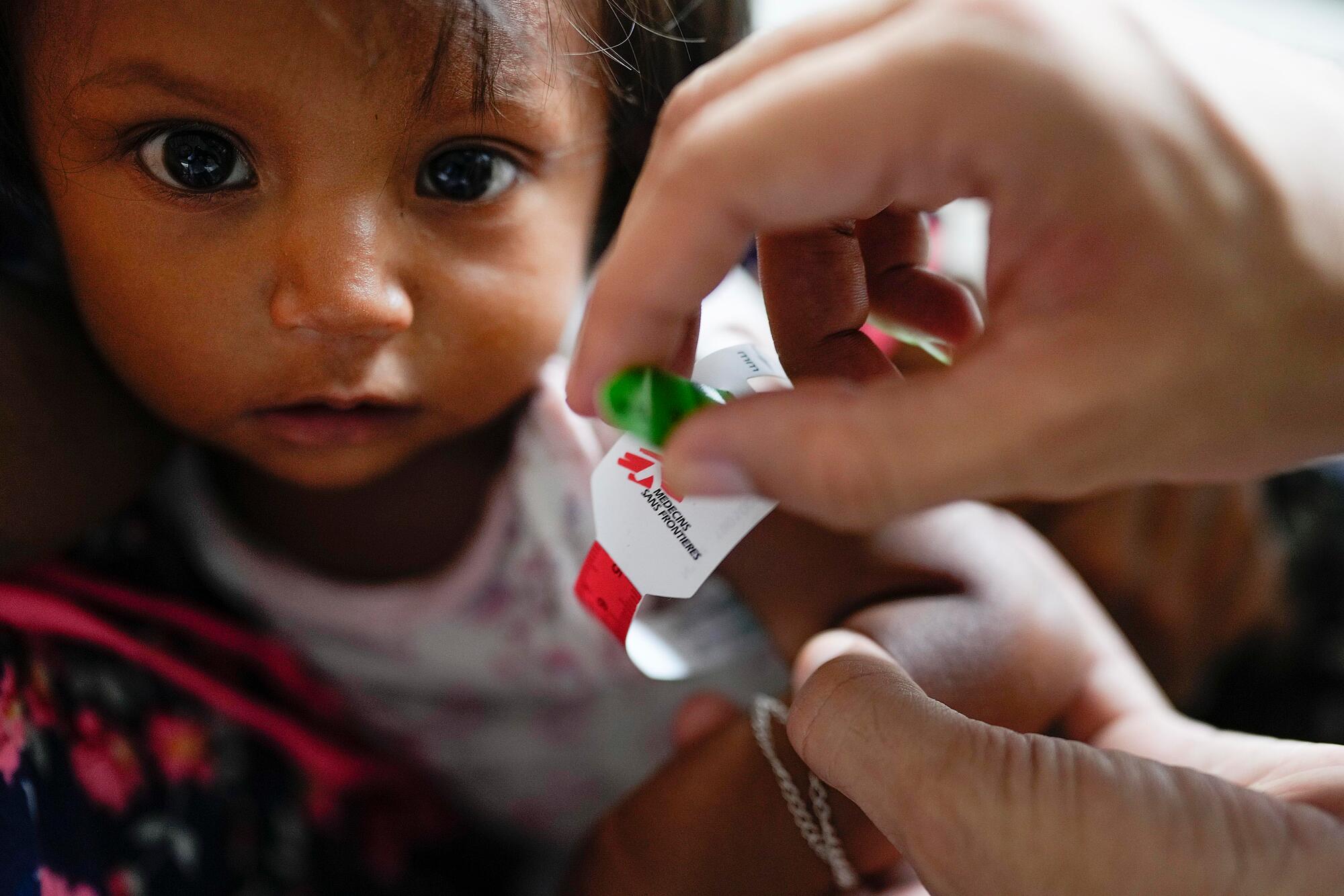 An indigenous child receives medical care from MSF teams in Venezuela.
