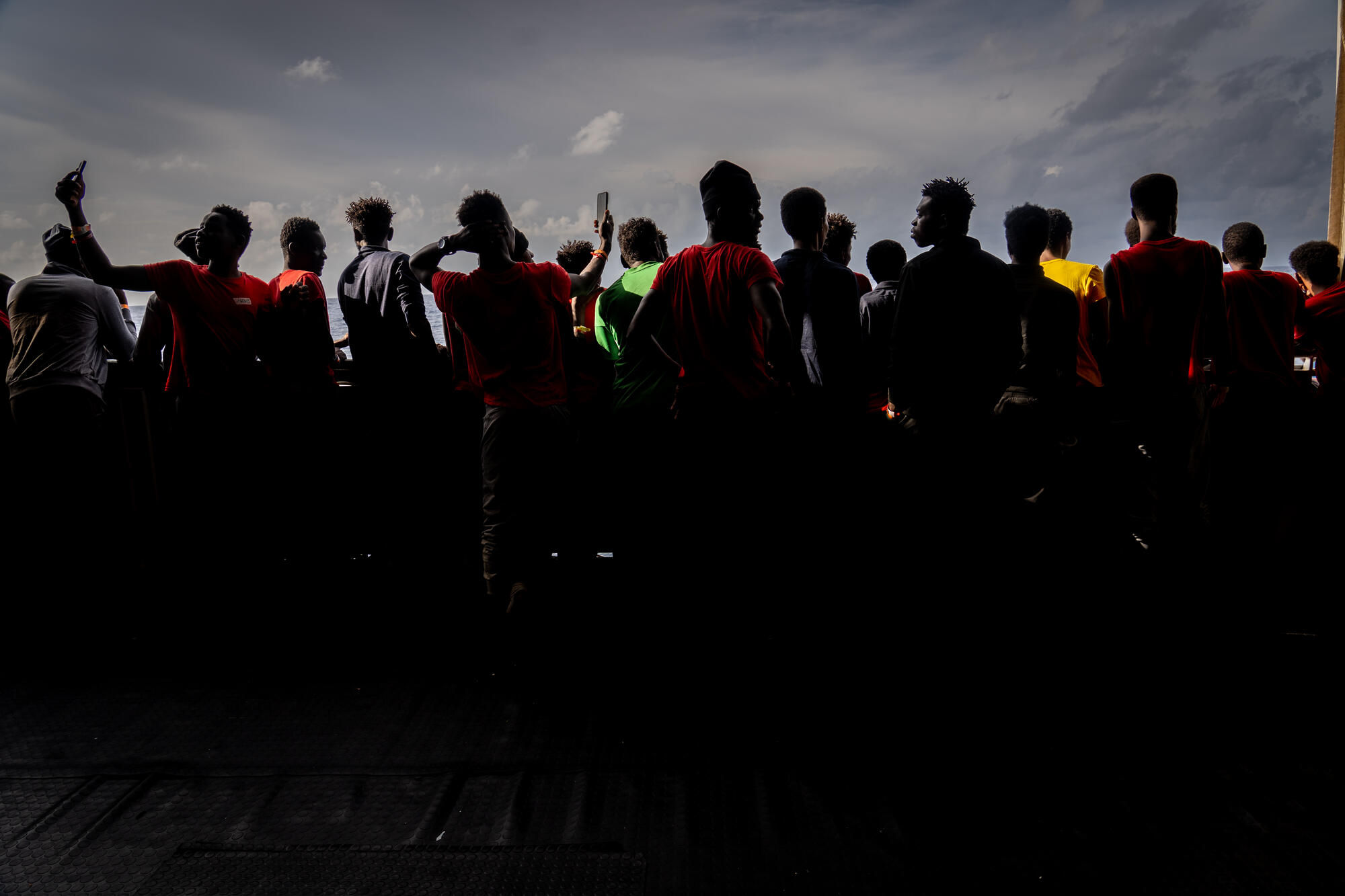 Silhouettes of people rescued by MSF from the Mediterranean Sea