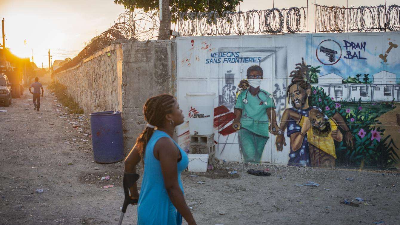 A woman walks down the street outside of MSF's trauma hospital in the Tabarre neighborhood of Port-au-Prince.