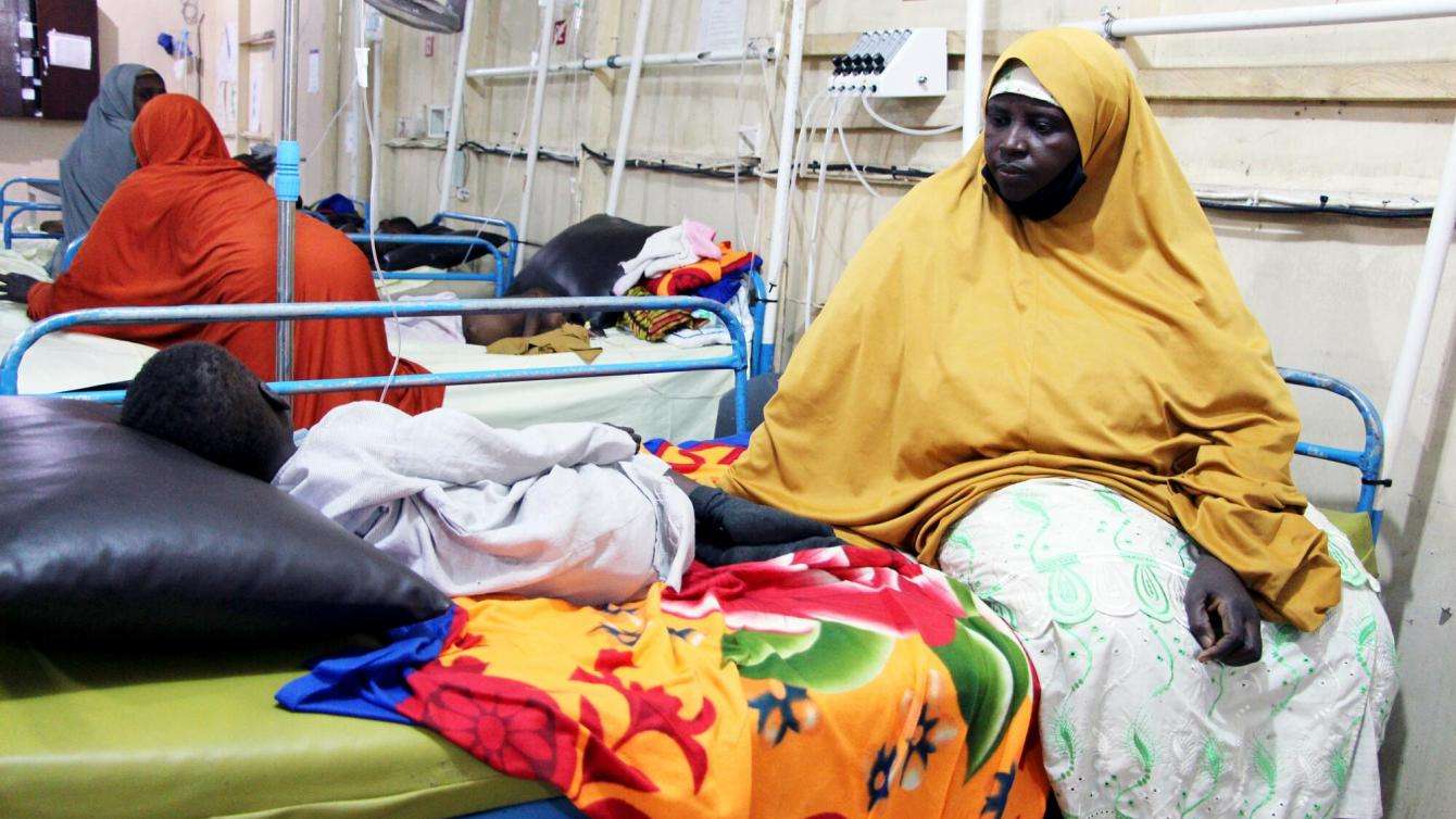 Grandmother takes care of an orphan in Gwange hospital