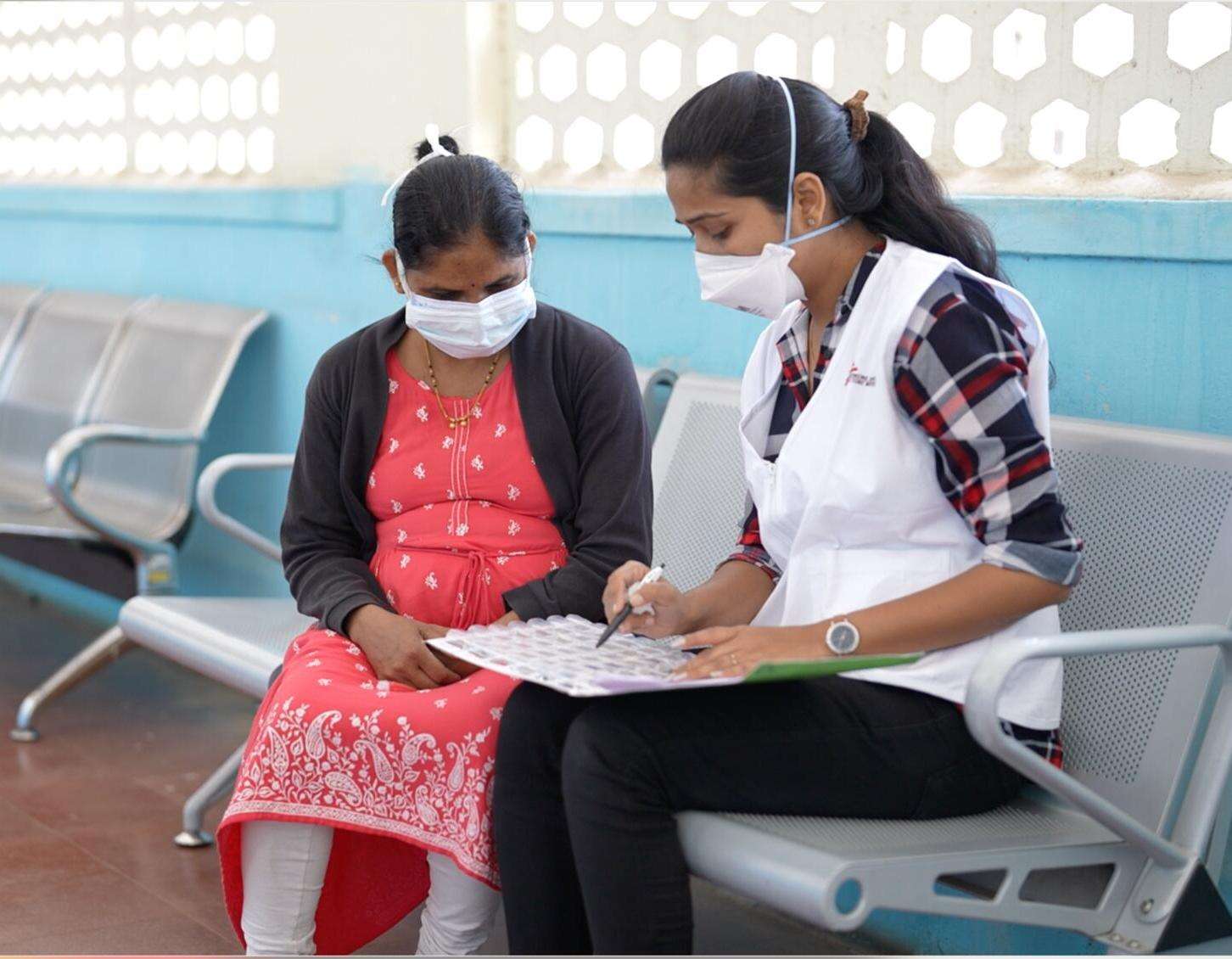 An MSF staff member in India talks to a patient who was part of the EndTB clinical trial to find better treatments for tuberculosis.