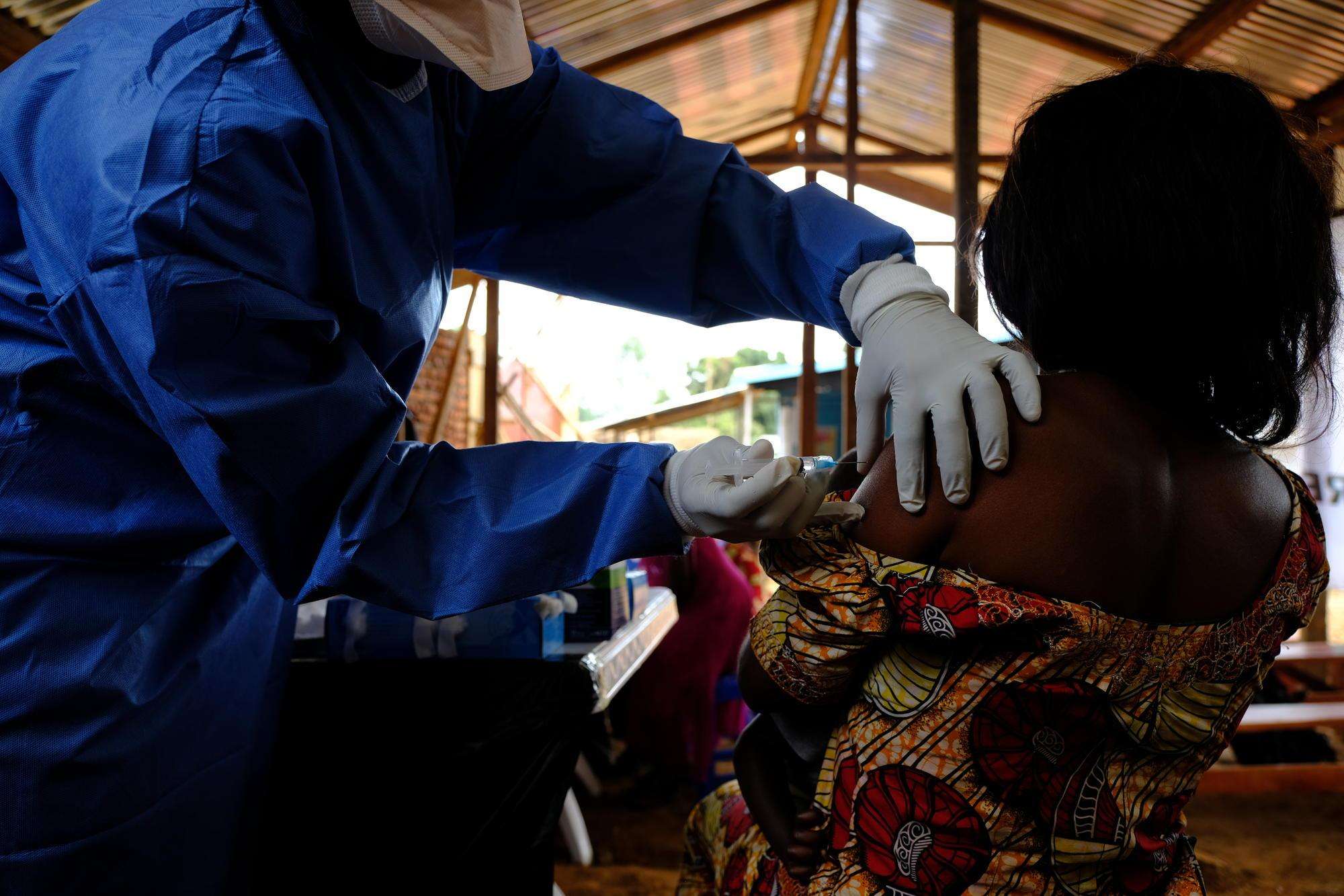 A health worker administers an Ebola vaccine at the MSF-supported health center of Kanzulinzuli, in Beni, DRC.