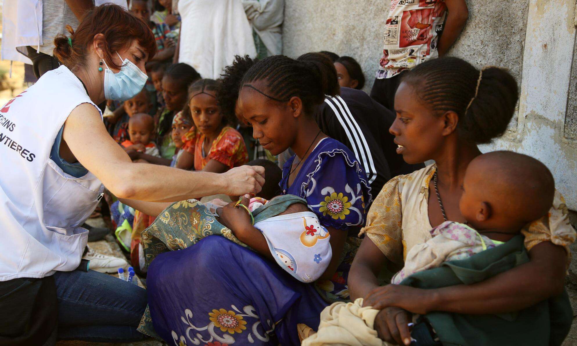 An MSF nurse screens a child for malnutrition at a mobile clinic in Adiftaw in 2021 in Tigray, Ethiopia.