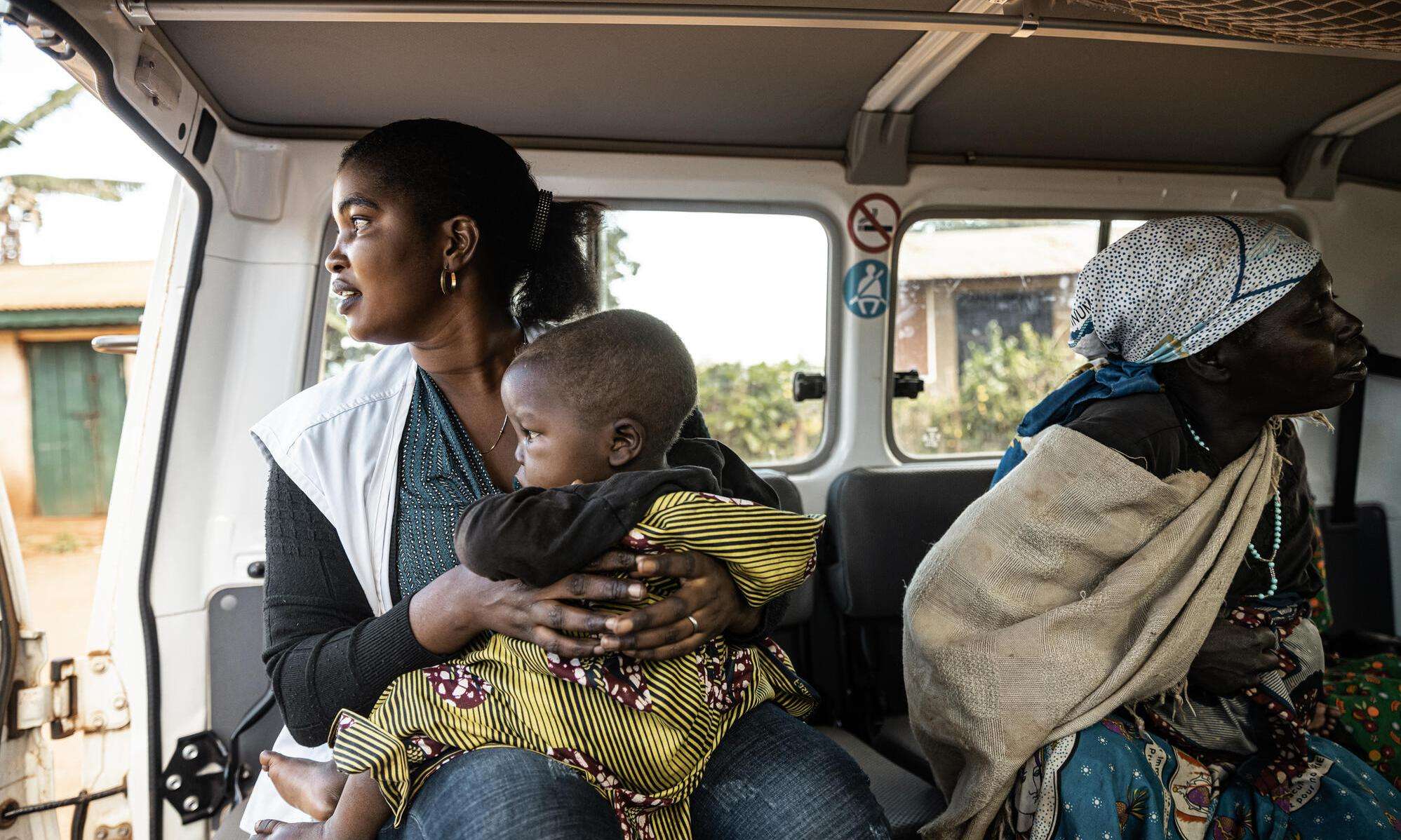 A woman and child sit in a vehicle in Ituri province, Democratic Republic of Congo (DRC)