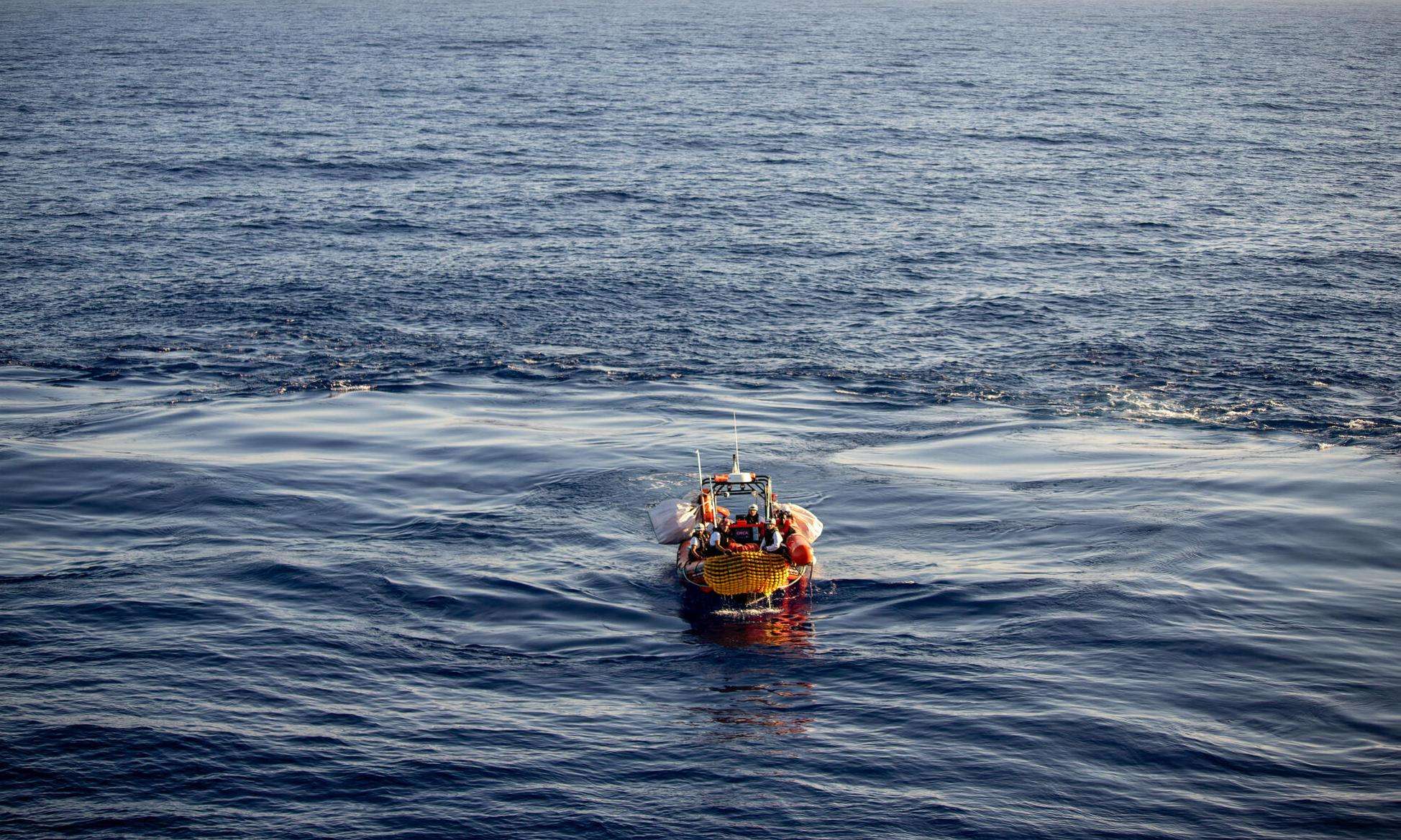 An aerial view of a small MSF rescue boat in the middle of the  Mediterranean sea.