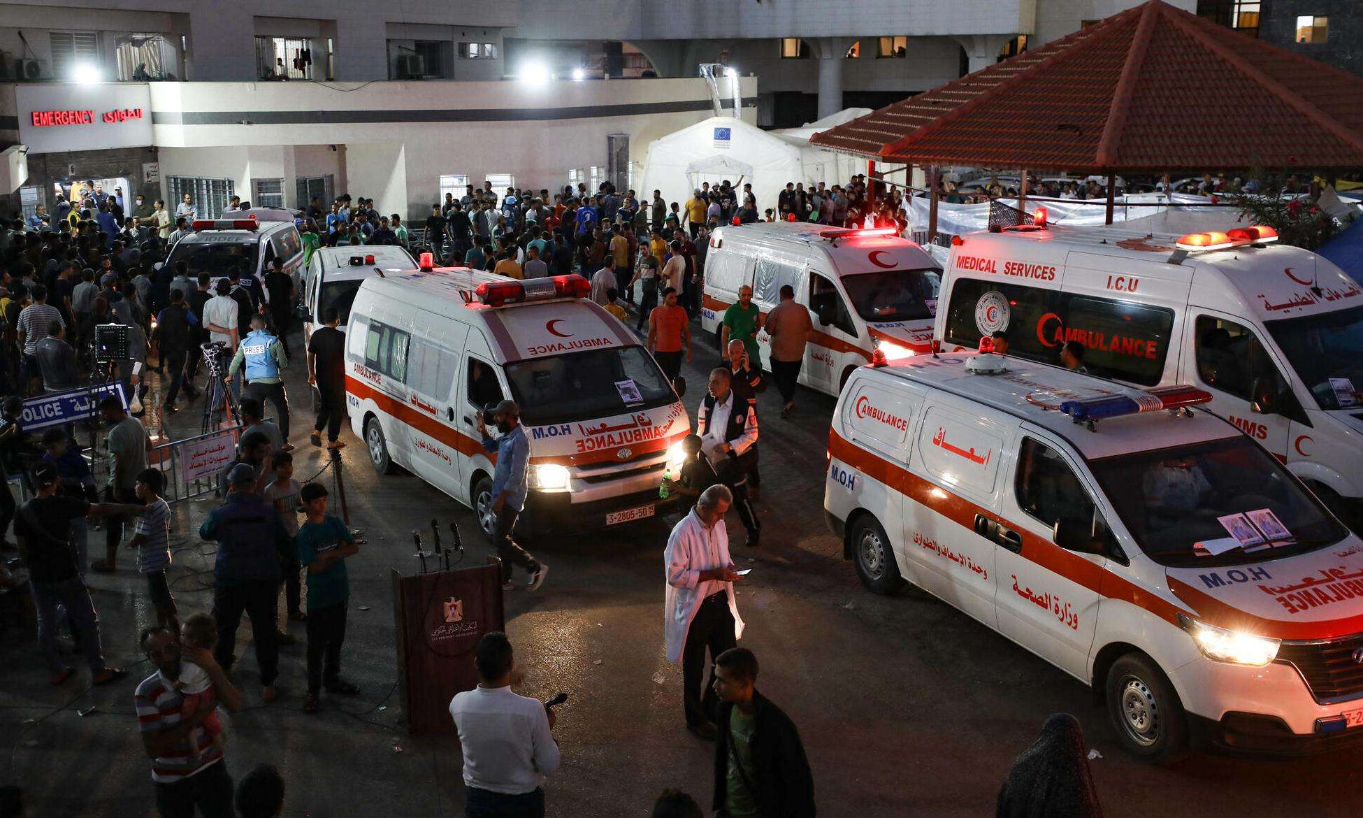 Ambulances and crowds around Al-Shifa hospital during the Israel-Gaza war in 2023.