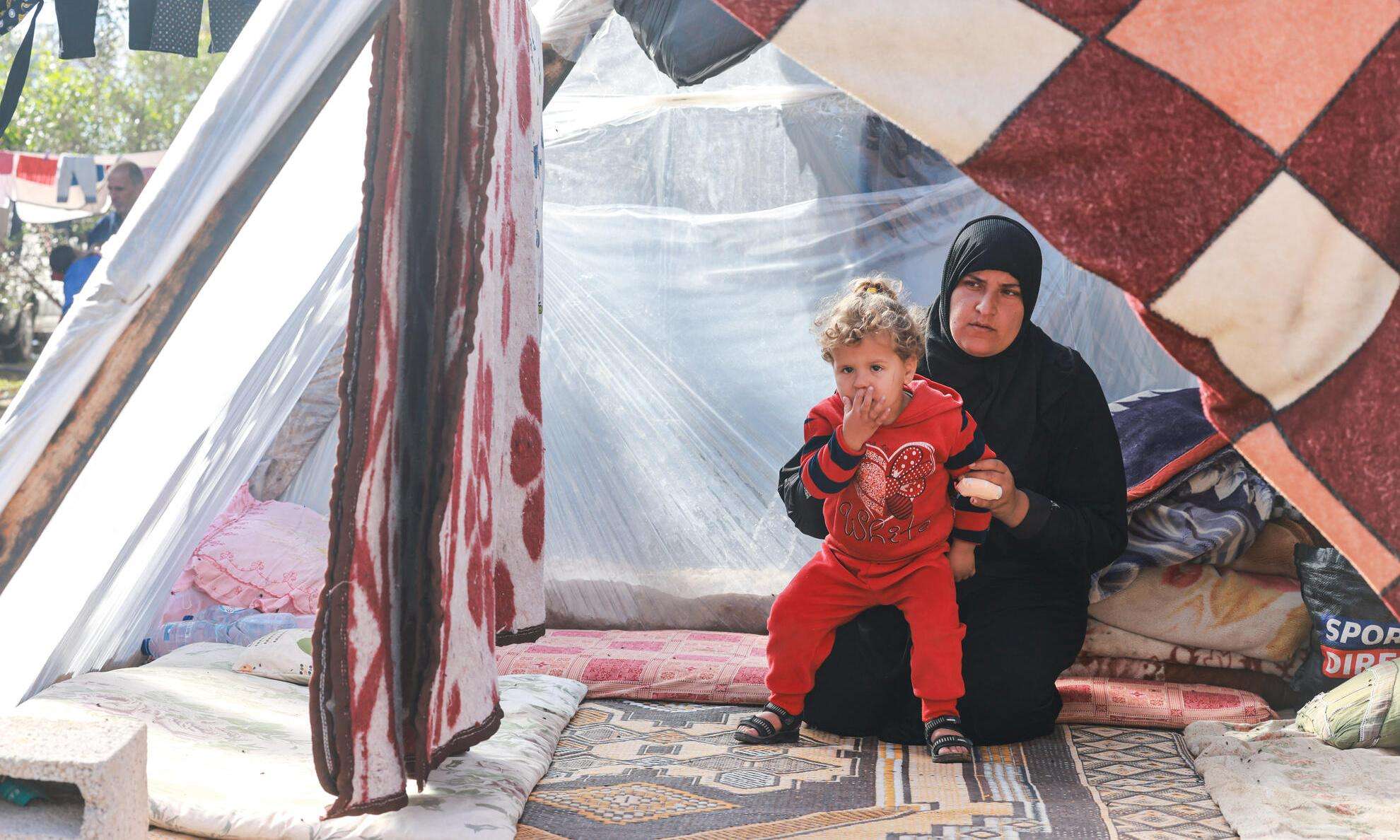 A woman and child in a shelter in Rafah, southern Gaza.