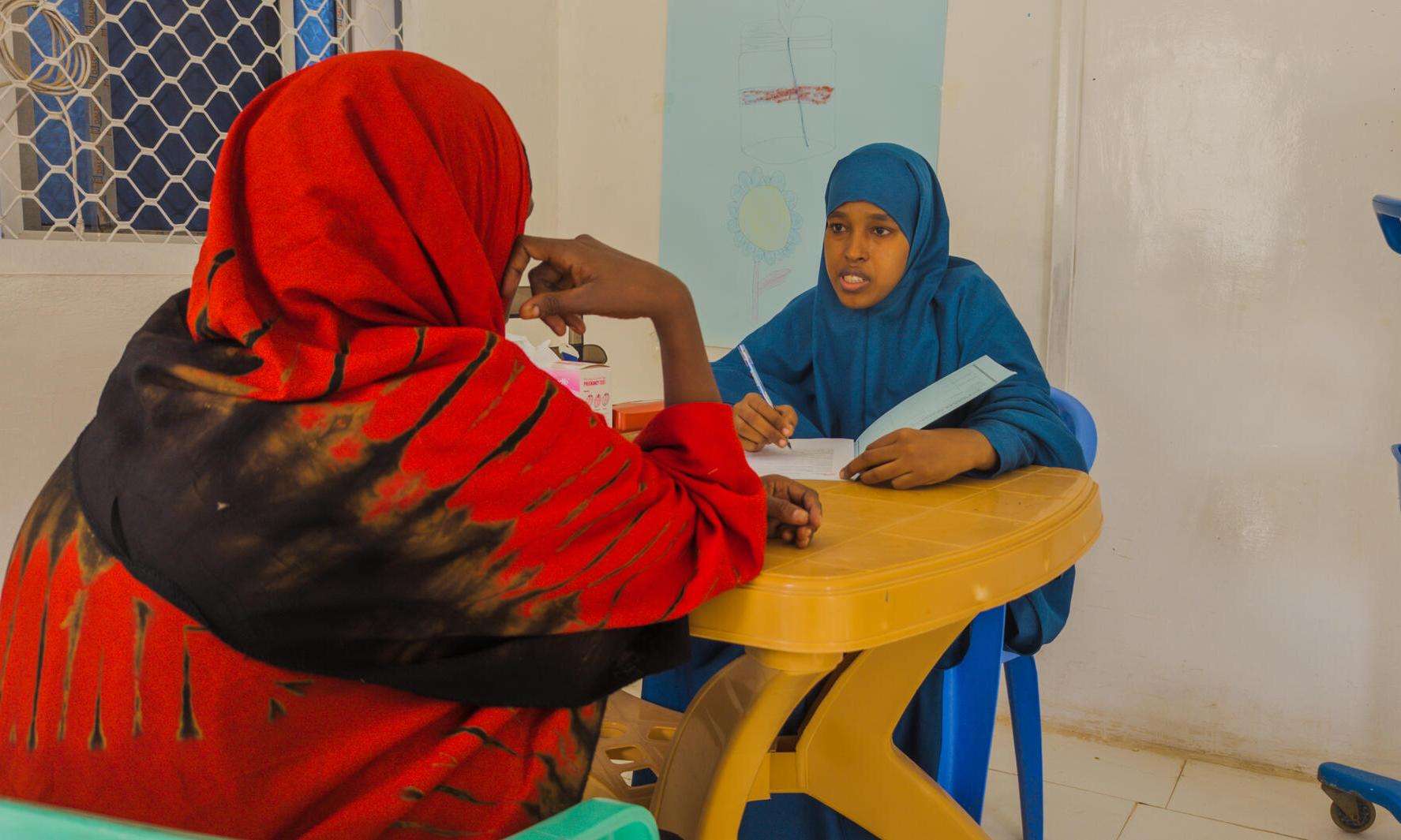 A woman has a consultation in Somalia. 