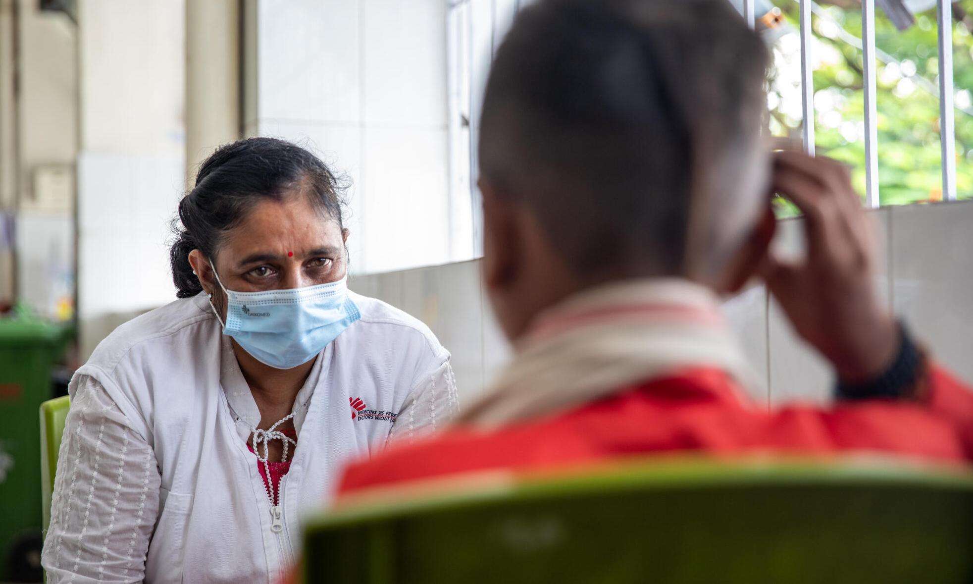 Sameer*, a patient living with advanced HIV, talks to a counselor at the Guru Gobind Singh Hospital in Patna, Bihar.