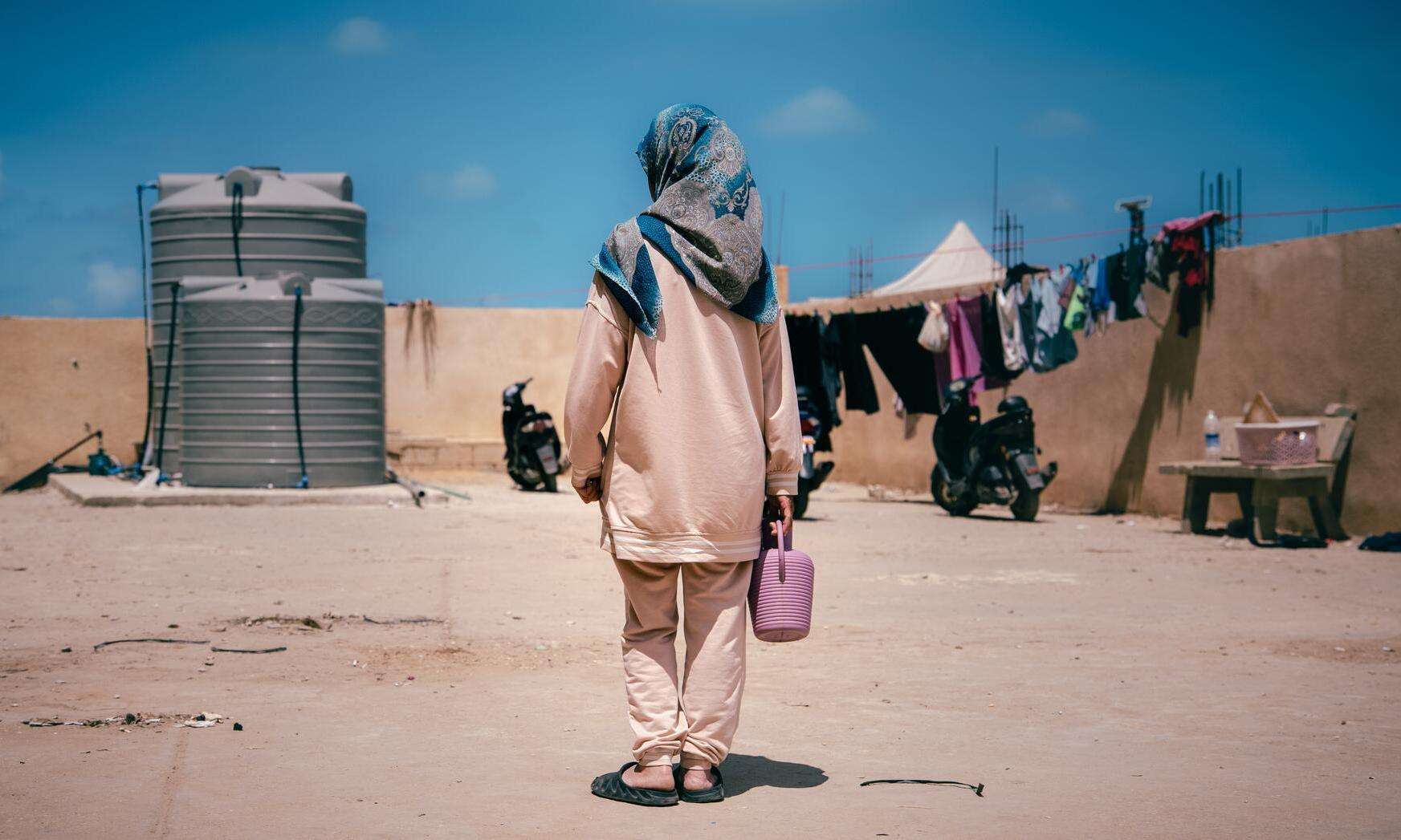 "Every flower has a story and a name, and I care for them like my own children," says Warde*, a displaced woman who bought flowers for her shelter out of longing for her garden back home in Deir Al Zahrani, Nabatiyeh governorate, Lebanon.