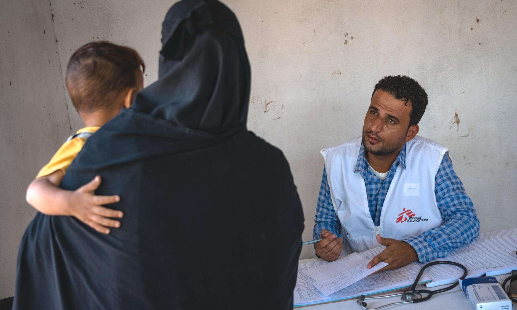 A mother takes her child for a checkup in Yemen. 
