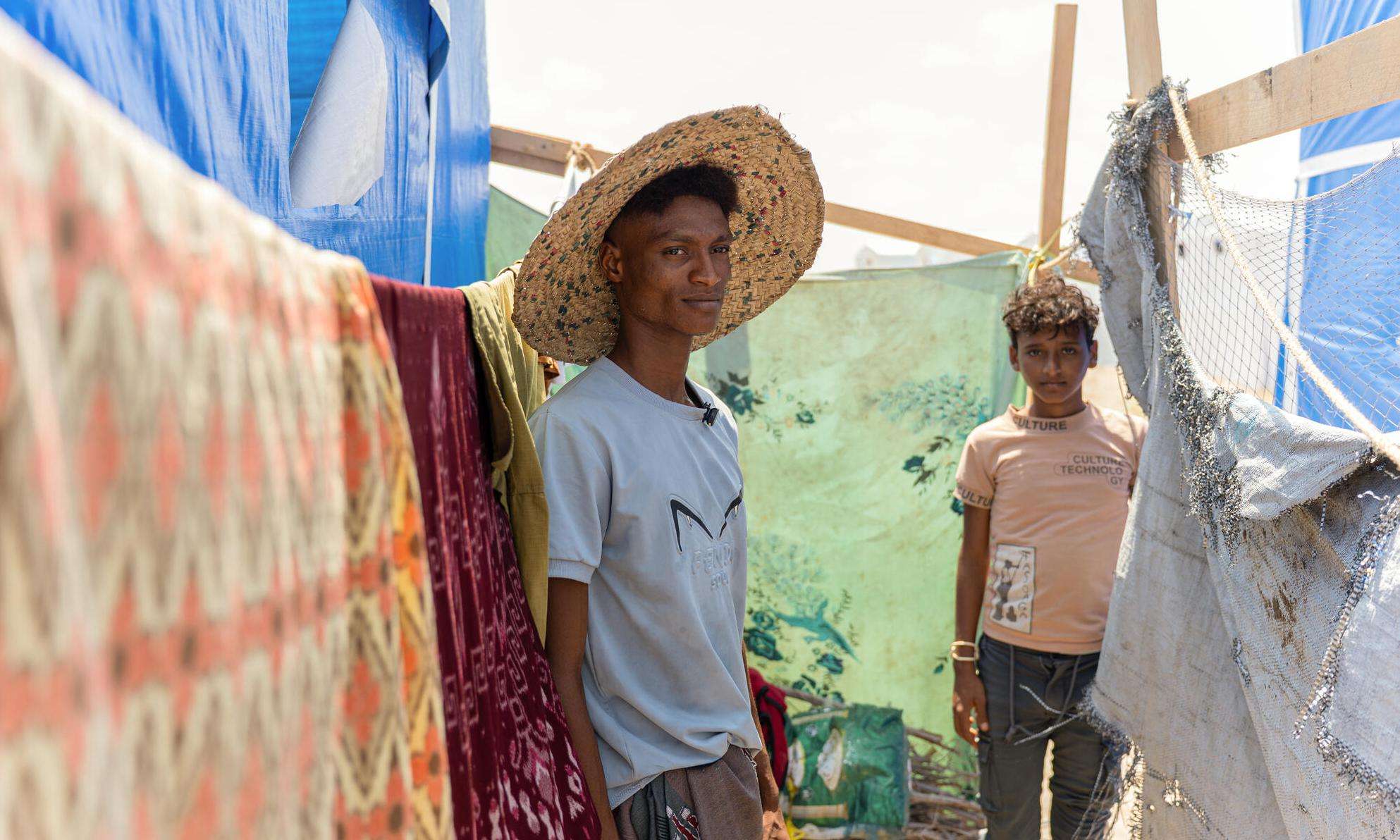 Displaced men in a camp in Yemen.