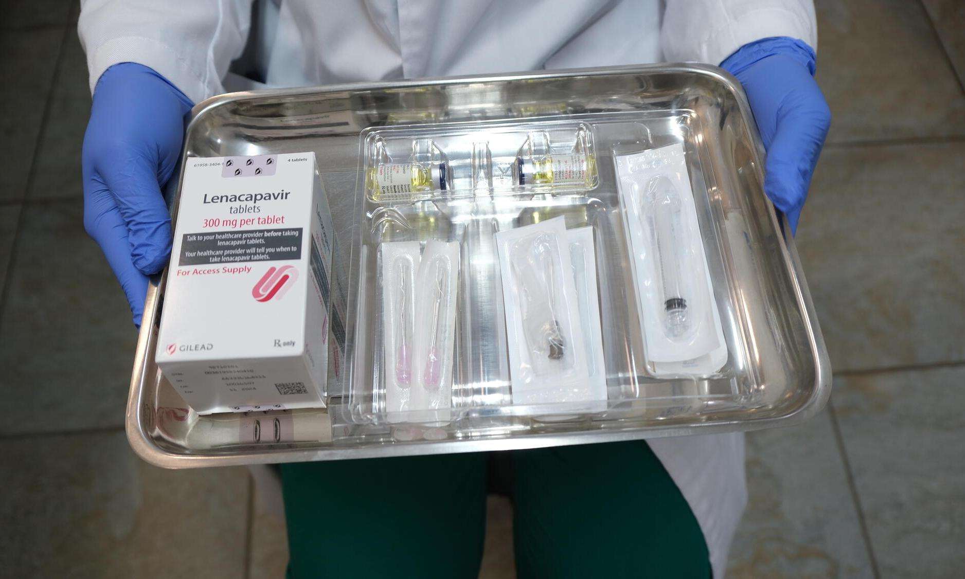 A doctor holds a tray of the HIV medication lenacapavir.