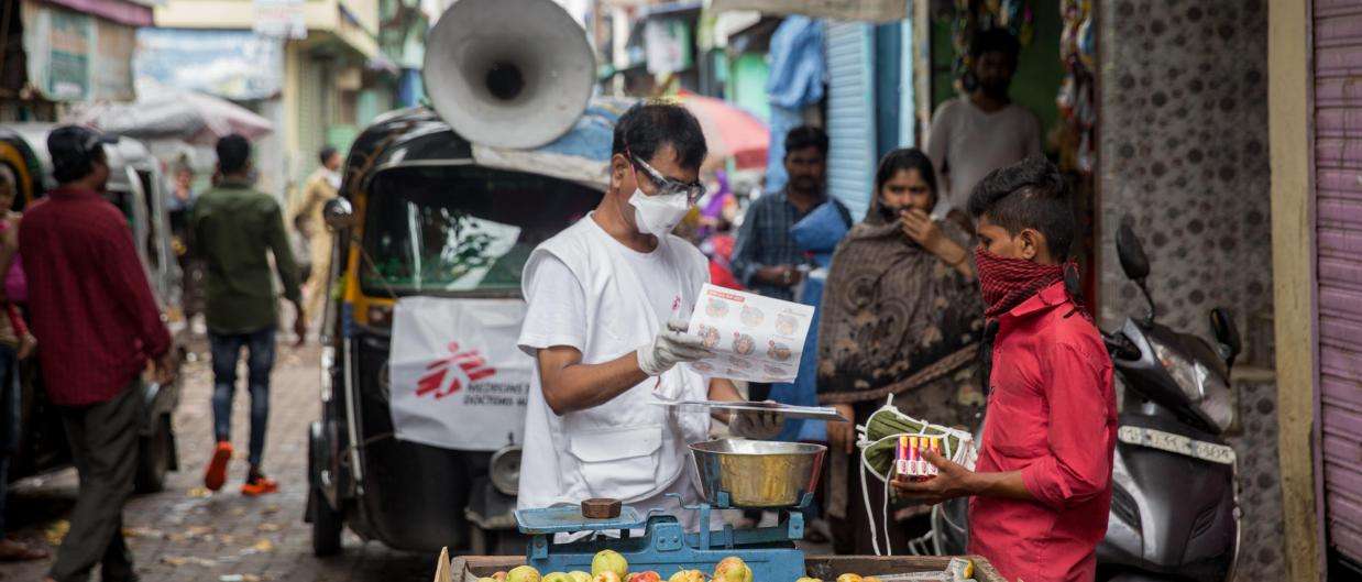 MSF staff Ganpat distributing soap and masks to hawkers on the street