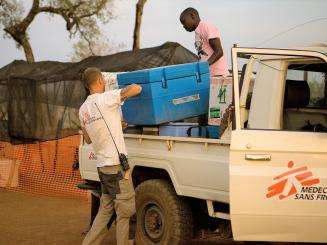 MSF Logisticians off-load vaccines at one of the vaccination sites.