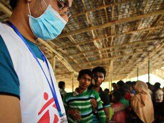 An MSF health worker at the entry point in Sabrang, where MSF runs a daily mobile clinic which provides health check-ups, general healthcare and nutritional screening for all new arrivals.
