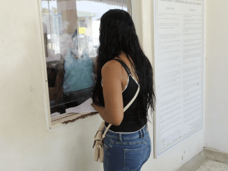 A woman waits to receive health care at Riohacha hospital in La Guajira department, Colombia.