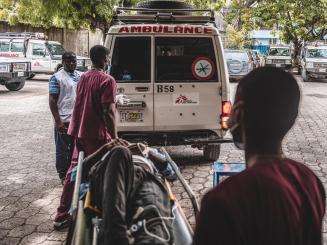 Staff load a patient onto an ambulance at MSF's Turgeau Emergency Center in Port-au-Prince, Haiti
