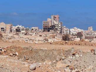 Crumbled cement buildings in a desert area of Derna where MSF is preparing further activities.