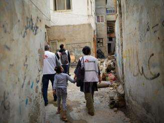MSF staff walk through an alleyway in Jenin refugee camp, West Bank, Palestine.