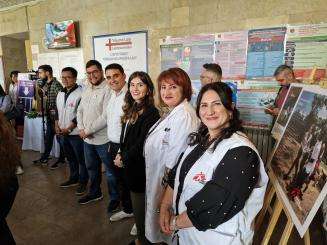 Smiling staff at the opening of a new hepatitis C clinic in Yerevan