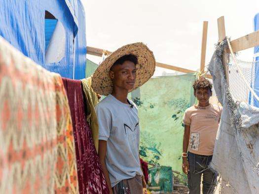 Displaced men in a camp in Yemen.
