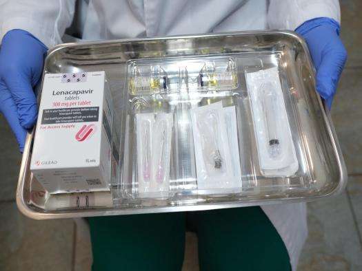 A doctor holds a tray of the HIV medication lenacapavir.