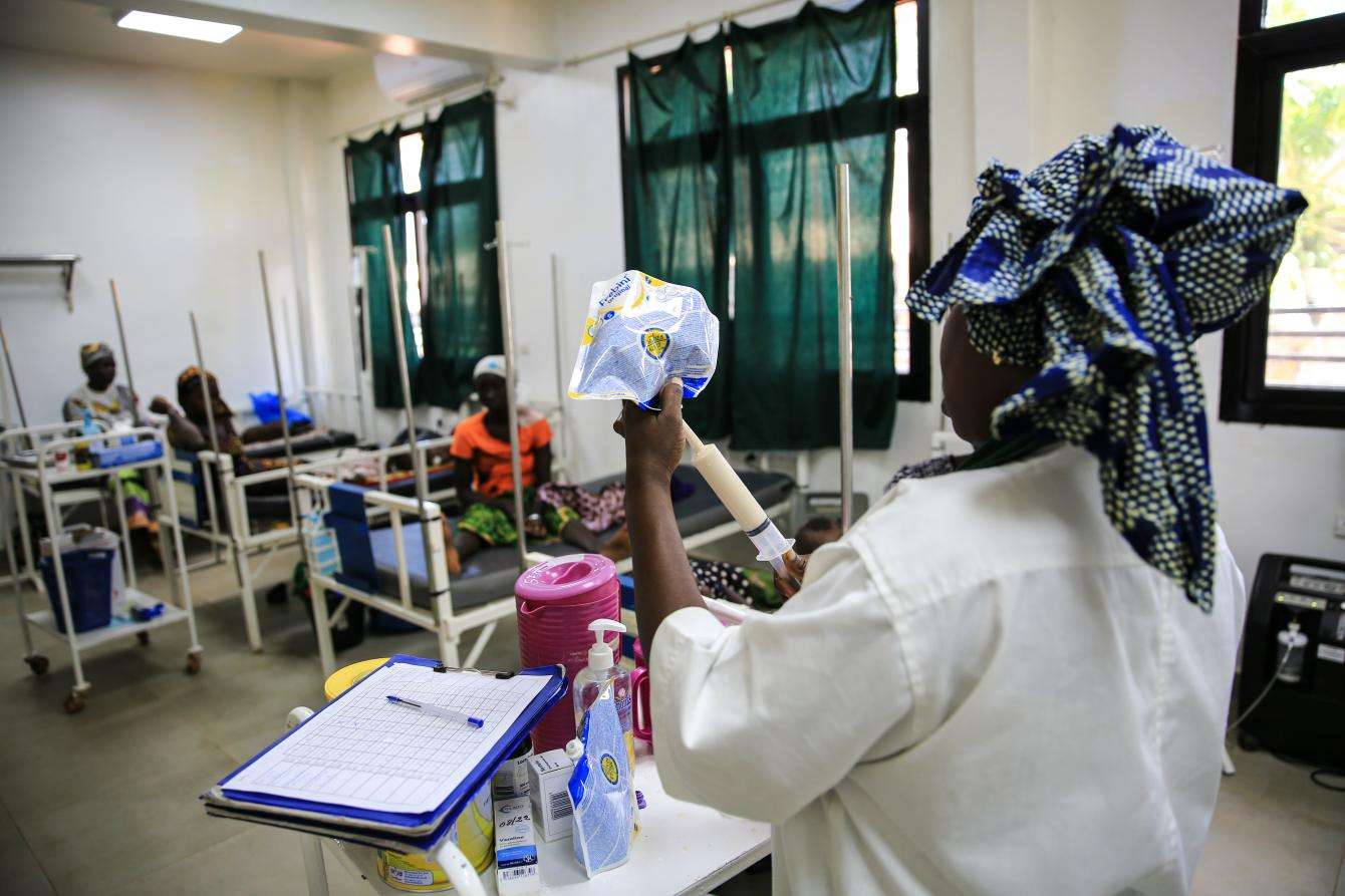 An MSF nurse prepares therapeutic milk for malnourished children. 