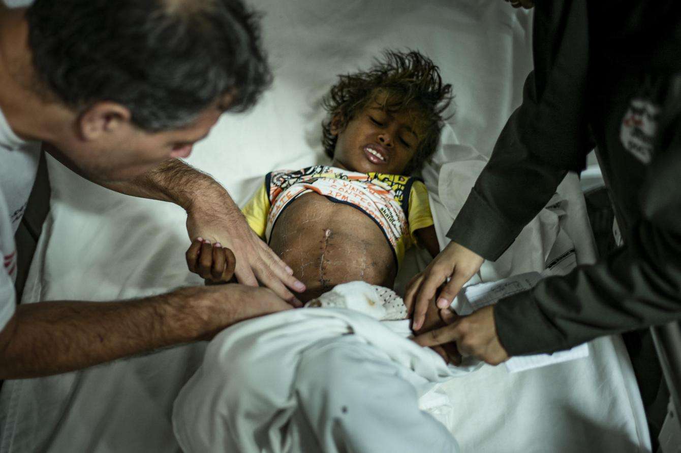 Operating on a child to remove a bullet