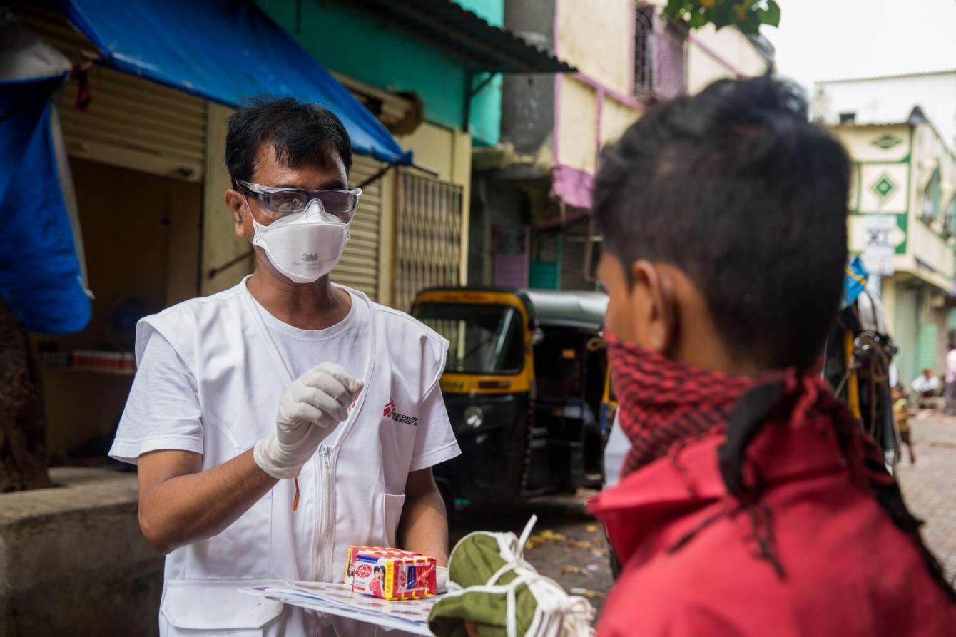 MSF staff Ganpat distributing soap and masks to hawkers on the street.jpg