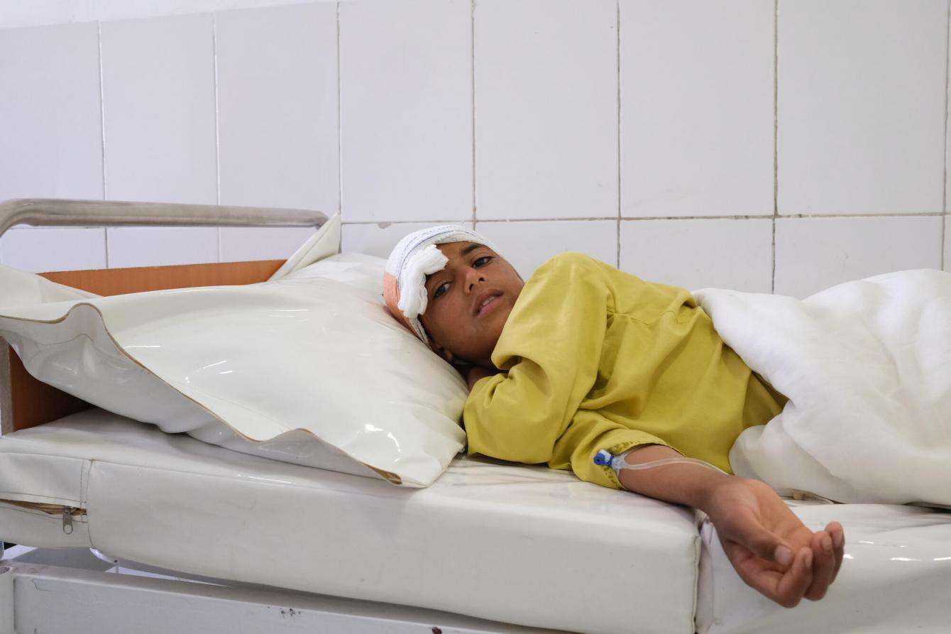 A young boy who suffered a gunshot wound to the head was treated at Boost hospital, Lashkar Gah, Helmand province.