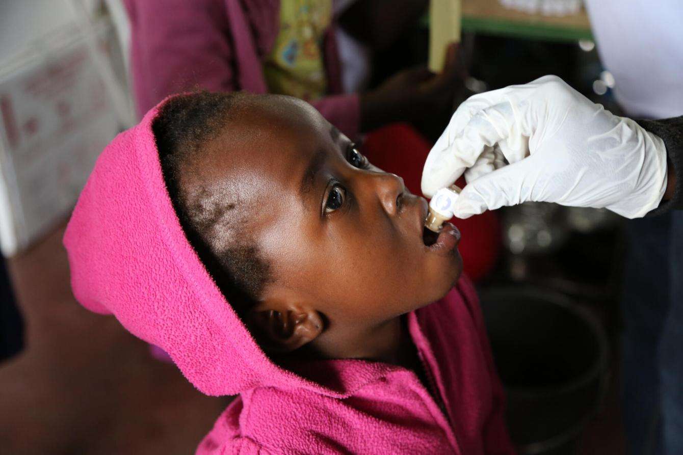 A child is immunized against cholera