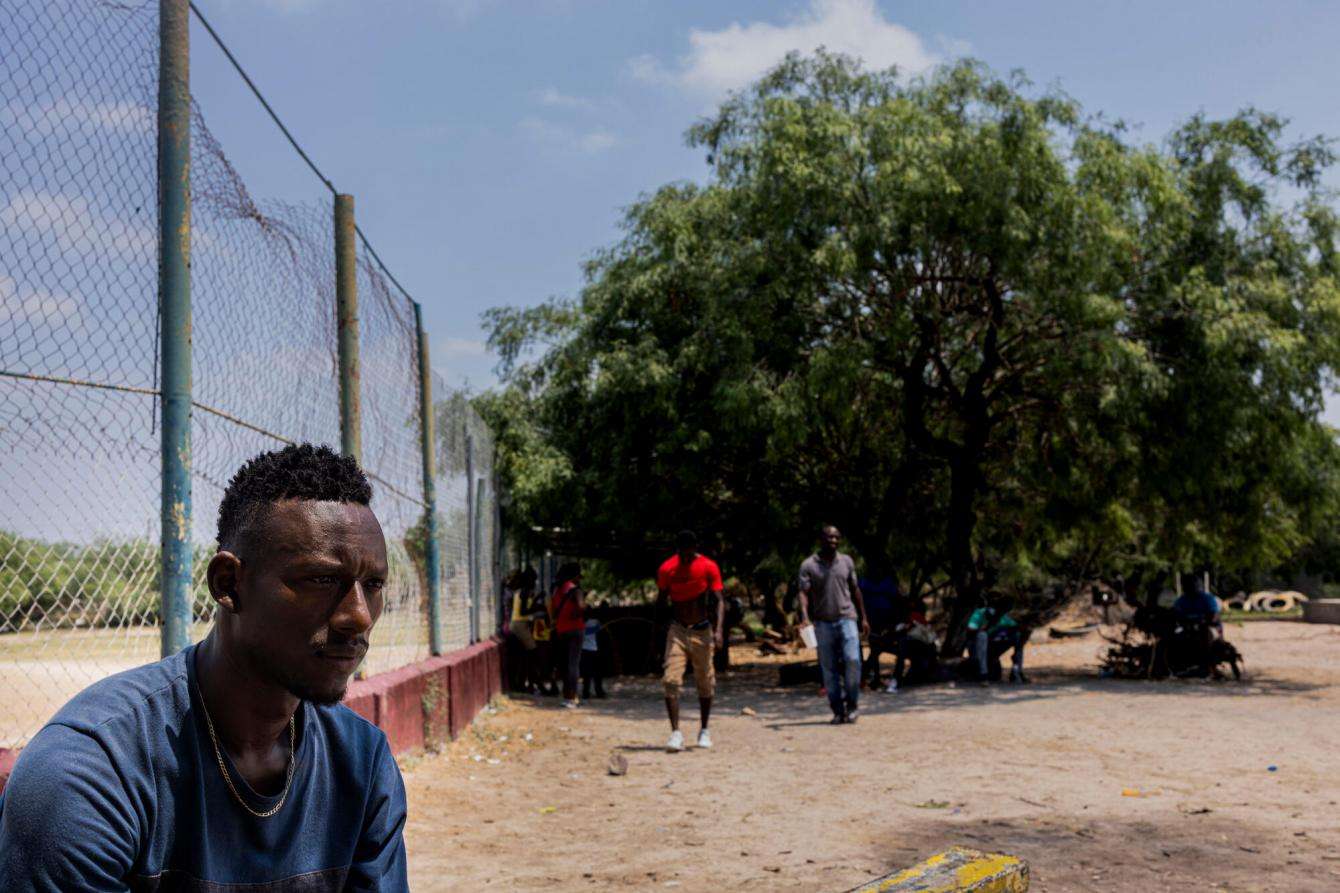 Wisly, 36, waits for entry into the “Senda de Vida” migrant shelter in Reynosa, Mexico. He left Haiti with his wife and two young children seeking better opportunities to support his family.