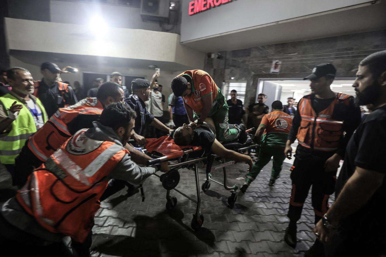 A Palestinian civil defense officer is resuscitated at Al Shifa Hospital in Gaza on October 16