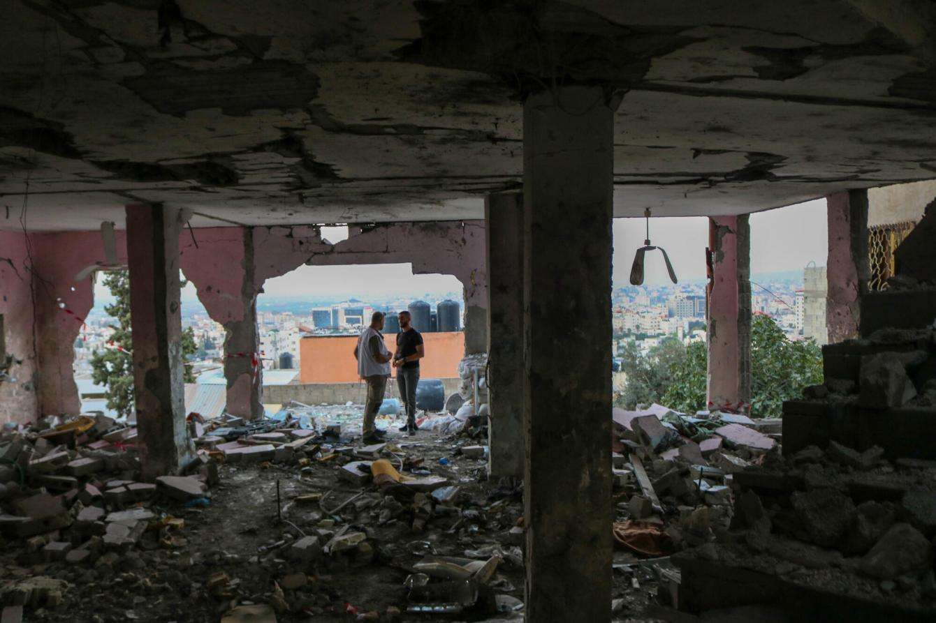 MSF staff and local paramedics inspect the remnants of a mosque that was destroyed in an airstrike in Jenin refugee camp in the West Bank, Palestine.