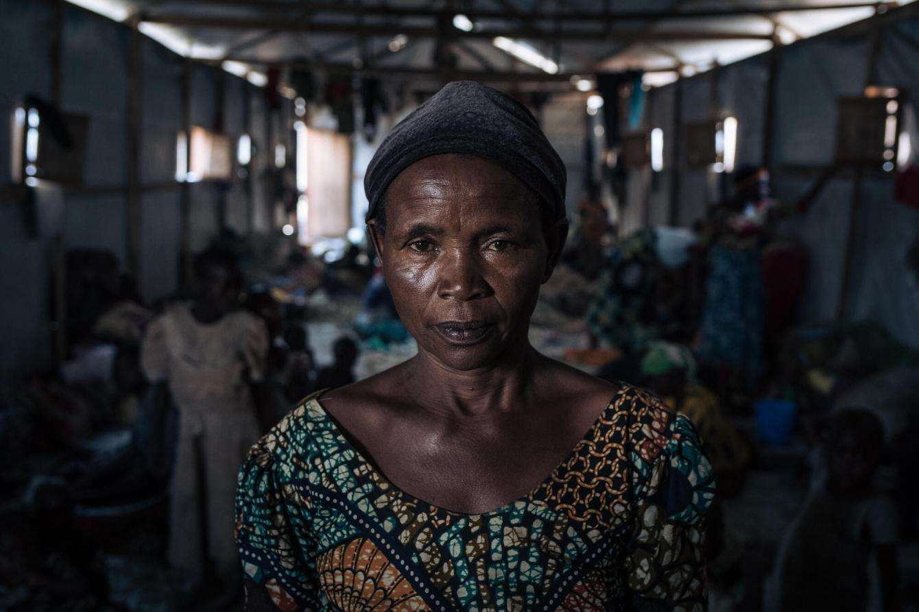 A displaced woman in a community shelter at the informal IDP site of Rugabo Stadium in Rutshuru Centre, in North Kivu province, eastern Democratic Republic of Congo.