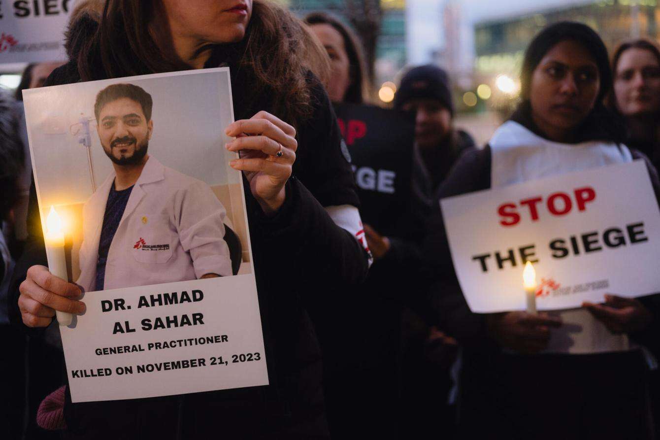 MSF-USA staff hold signs at a vigil calling for ceasefire at United Nations in New York.