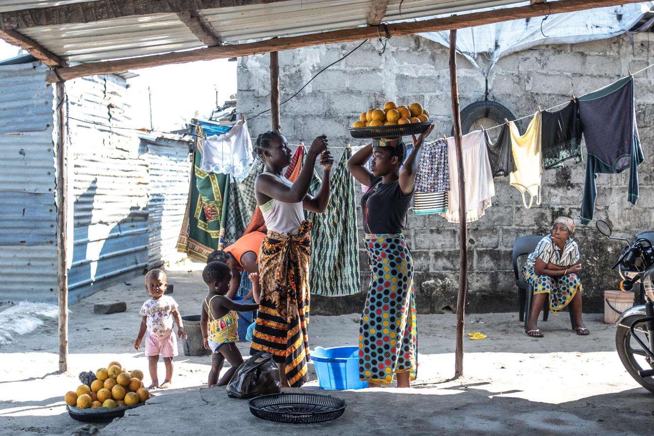 Women walk in an underresourced area of Beira, Mozambique. In 2014 the country liberalized its abortion laws in order to reduce the high number of maternal deaths caused by unsafe abortion. 