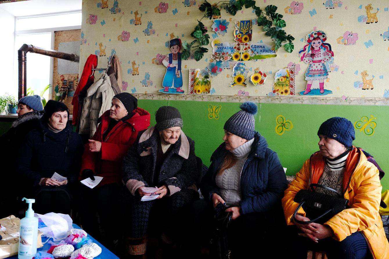 Patients are waiting in a queue for the mobile clinic in Lyman, Donetsk region, Ukraine.