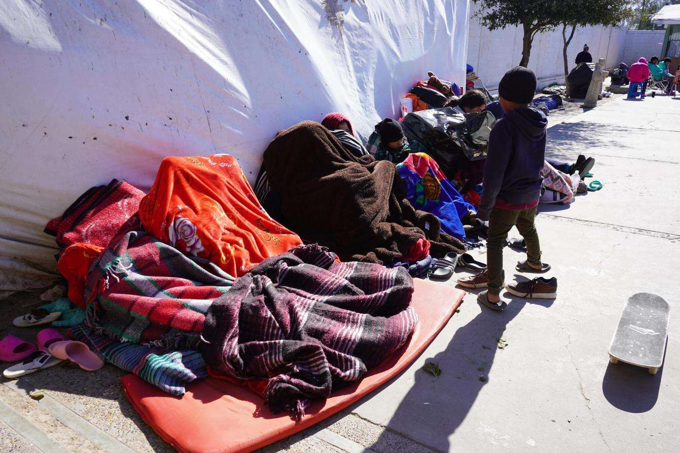 Migrants living in tents along the US-Mexico border.